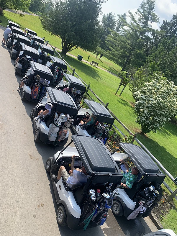 The Kara Fund Golf Tournament - Line up of golf carts ready to start the tournament