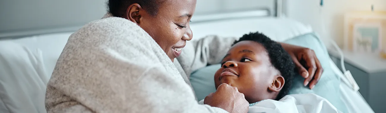 Mother and daughter in hospital bed